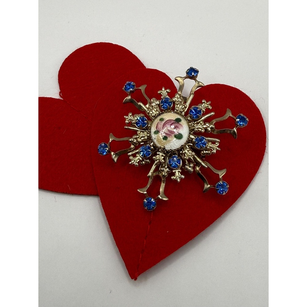 Gold-toned rhinestone starburst brooch floral enamel design blue rhinestones.‎